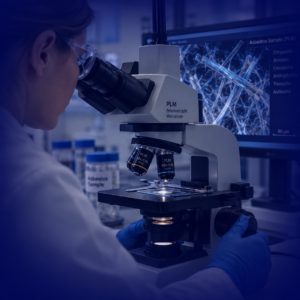 Asbestos laboratory technician analysing an asbestos sample